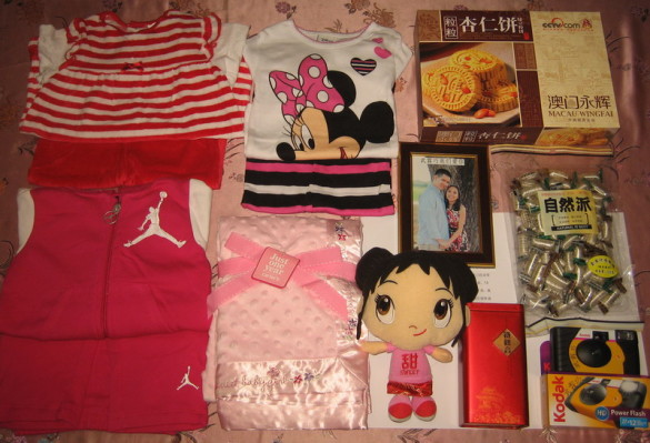 3 outfits, a blanket, a Kai Lan doll, 2 disposable digital cameras, a framed pic of us, and cookies, tea, candy and fruit (not pictured) for her foster parents