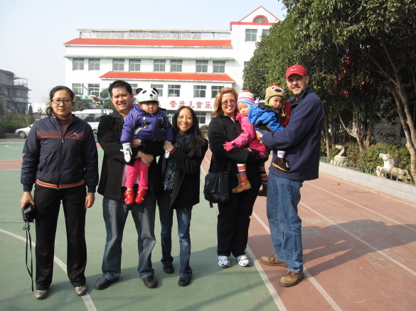 With another Holt family and one of the Directors of the Wuhan Municipal Children's Welfare Institute