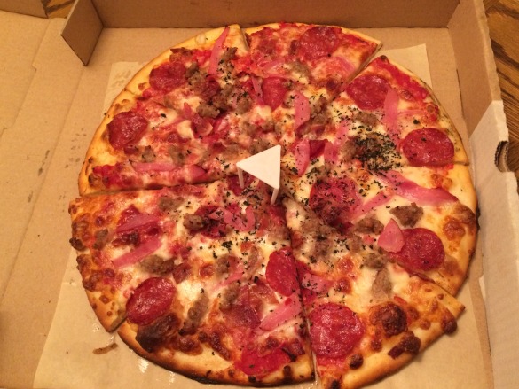zCarnivore Pizza with marinara, pepperoni, fennel sausage, smoked bacon, & fresh oregano