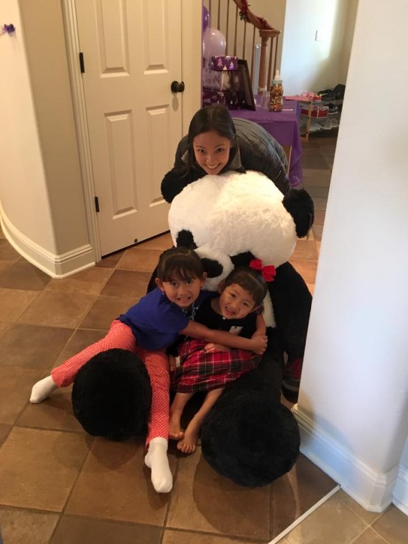 The panda bear from Auntie Ali was so big that Roxy didn't know whether to hug it or sit on it. So she did both! 