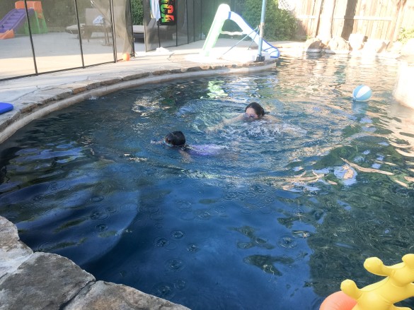 Roxy swimming with Melinda, her Sunsational swim instructor