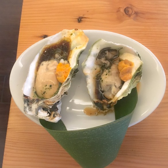 Grilled Oysters with soy, butter, and uni